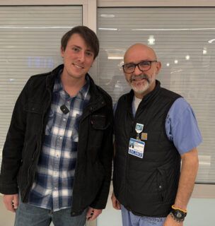 Trevor, patient, standing with Dr. Garcia-Montilla, ECMO expert
