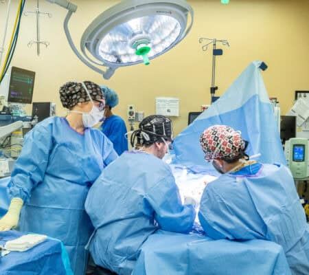 Doctors surrounding a patient on a surgery table