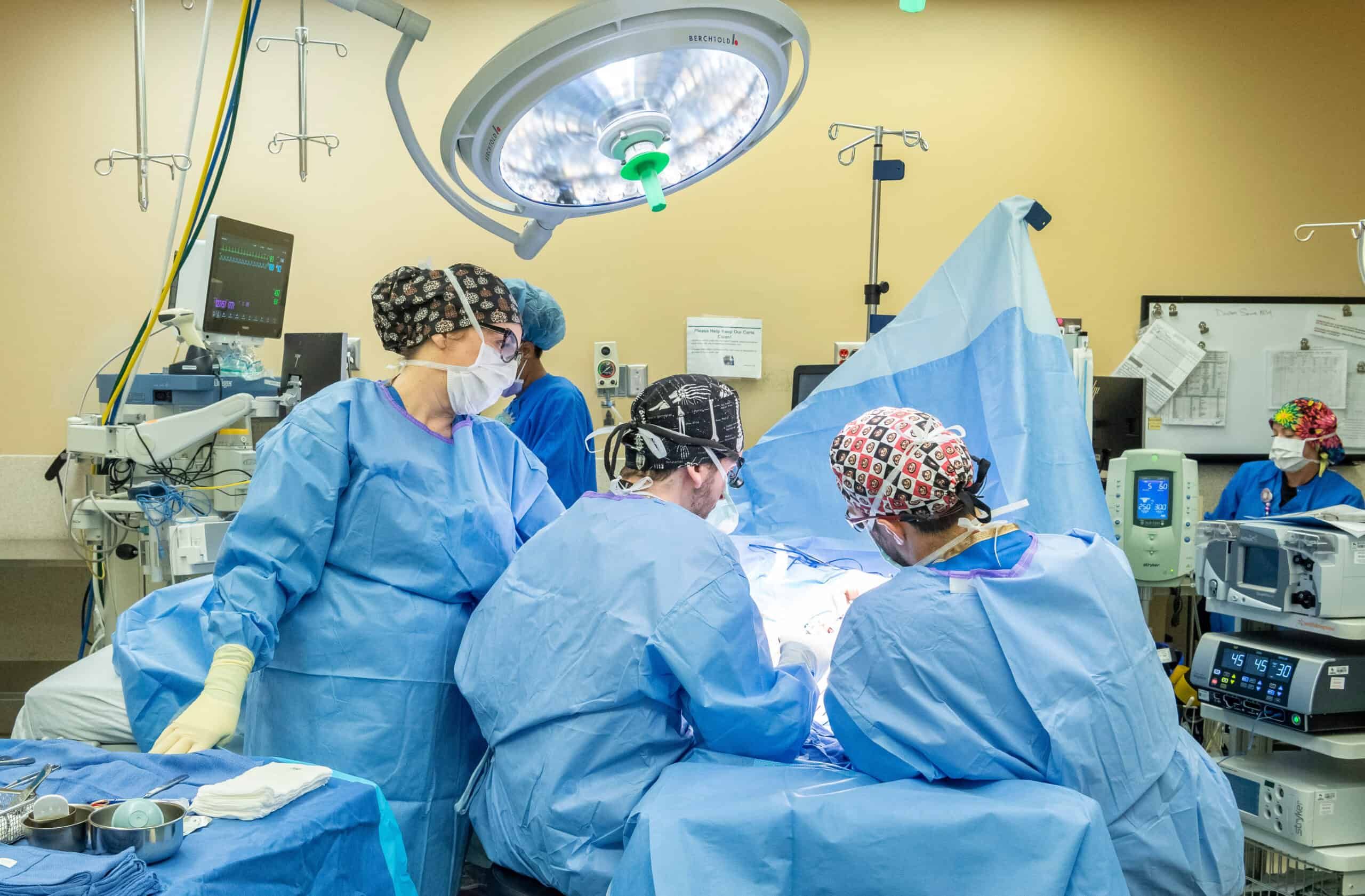 Doctors surrounding a patient on a surgery table