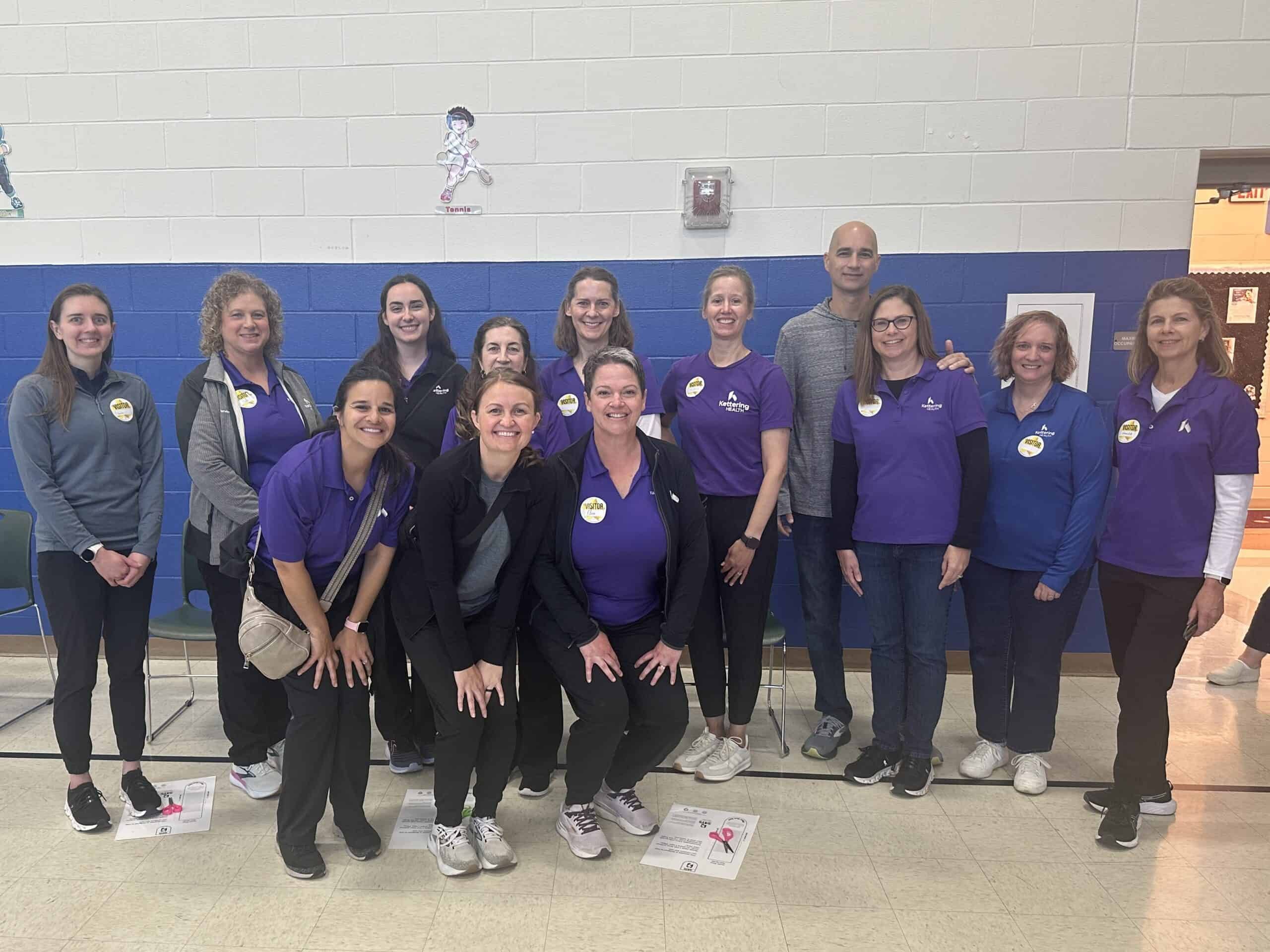 Kettering Health’s Therapy and Sports Medicine team volunteers with Shoes 4 the Shoeless.