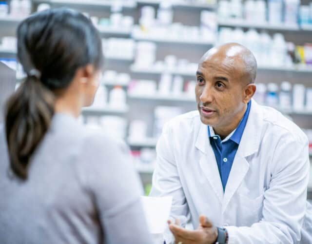 Medical professionals and pharmacists provide medication at the pharmacy.