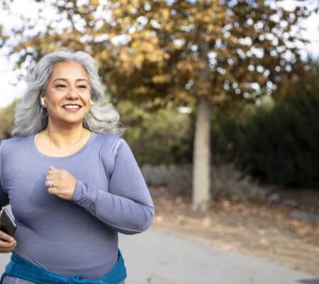 Woman walking on a bike path