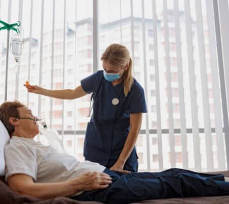 Doctor supporting a sick patient before medical procedures in a hospital room. High quality photo