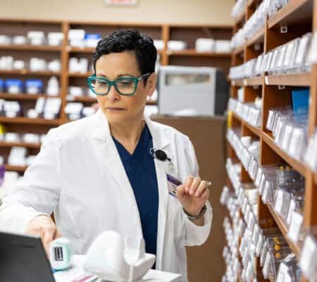 Medical professional working inside a hospital pharmacy