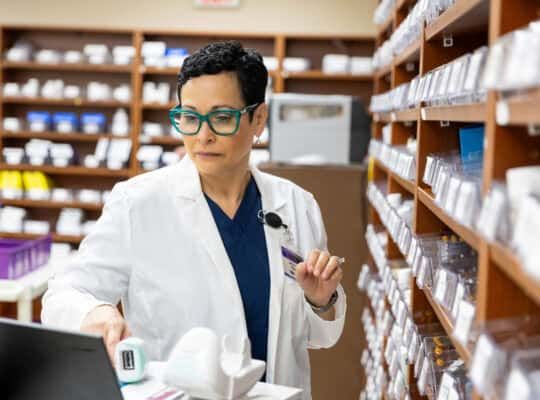 Medical professional working inside a hospital pharmacy