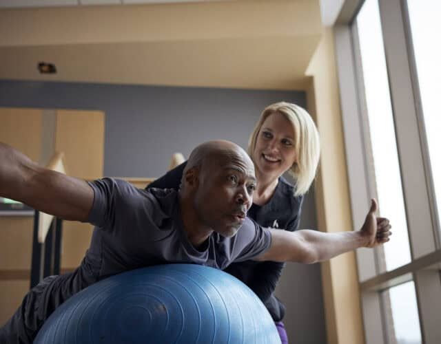 Physical therapist working with a patient