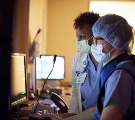 Nurse talking with physician
