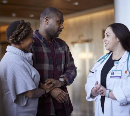 Physician talking with patient family