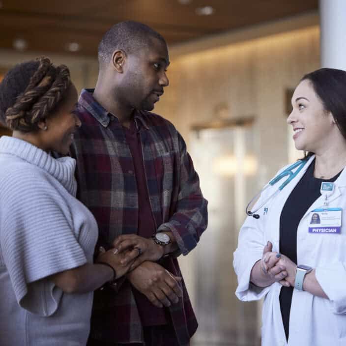 Physician talking with patient family