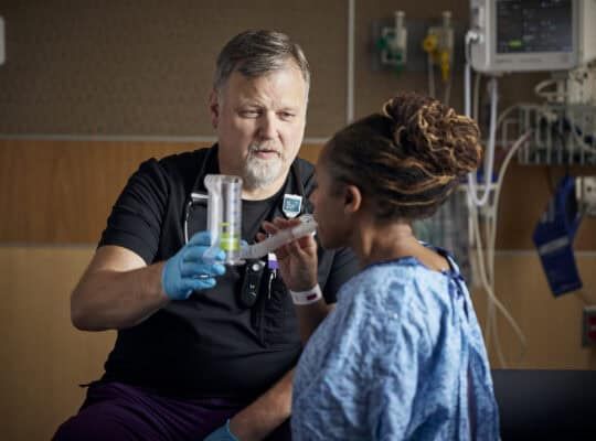 Respiratory therapist with patient