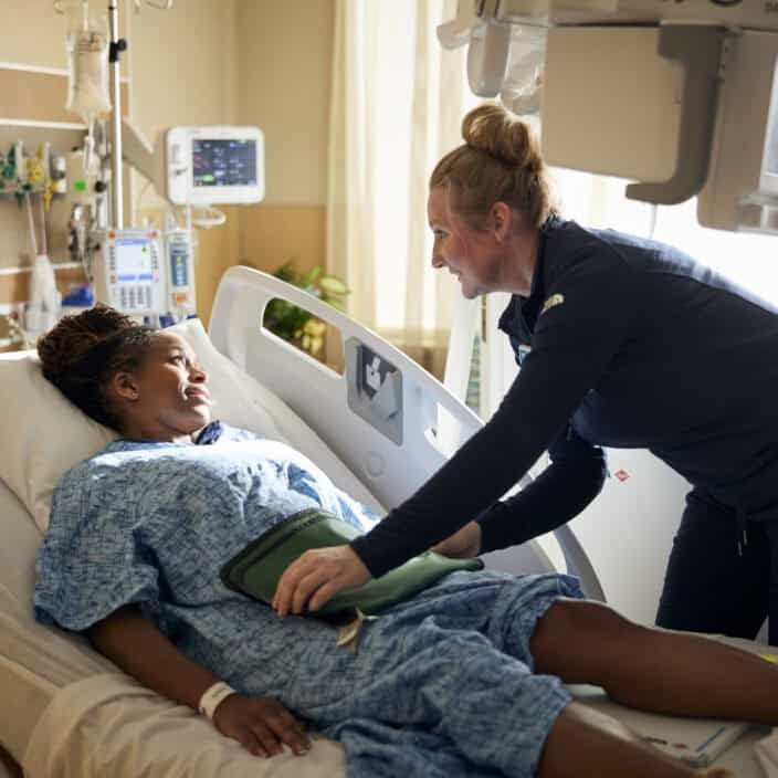 Xray tech helping a patient