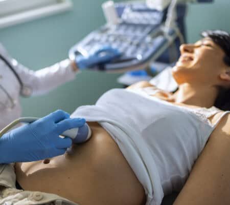 Young woman having 4D ultrasound scan.