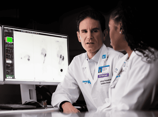 Oncology physician talking with collegue