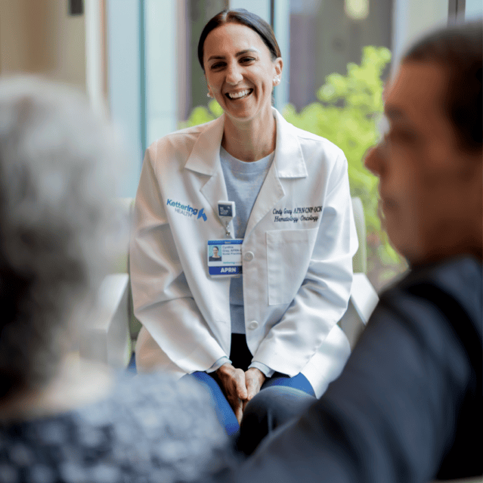 Oncology doctor talking to cancer patient