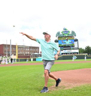 David Cookson throwing the first pitch at the Sports Med Game at the Dayton Dragons stadium