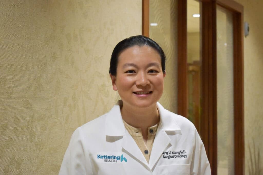 Dr. Jing Li Huang smiles for a photo.