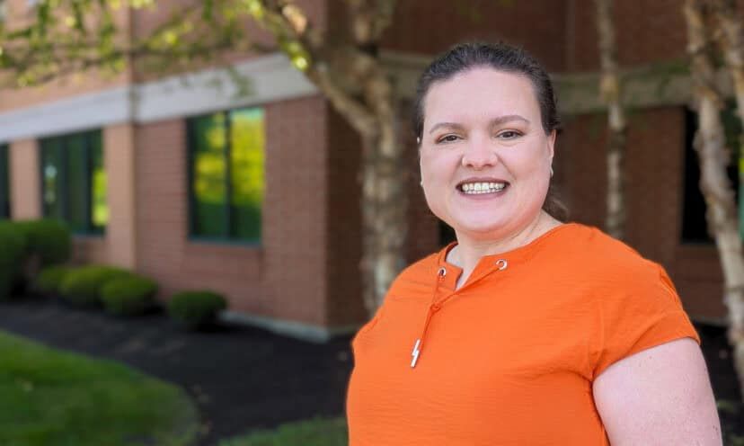 Dr. Kali Hollingsworth, Sports Medicine Fellowship Director, smiling for a photo outside a building