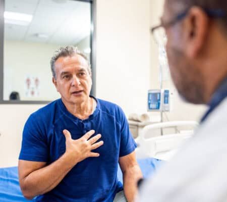 A senior man and doctor having a conversation about health