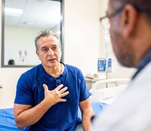 A senior man and doctor having a conversation about health