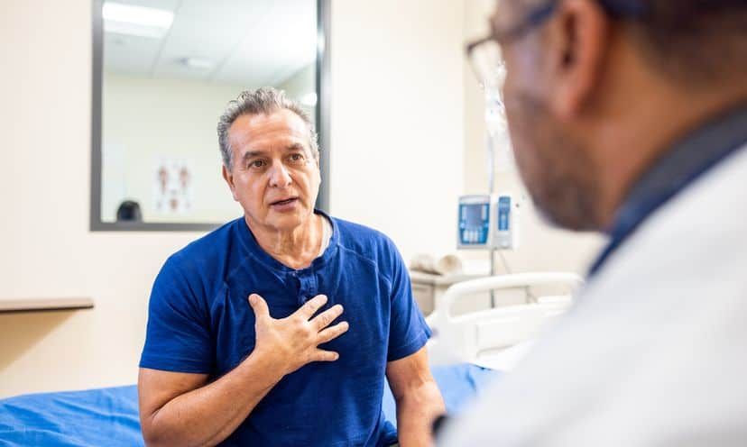 A senior man and doctor having a conversation about health