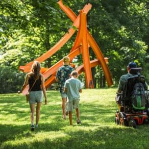 Family walking through an Art park
