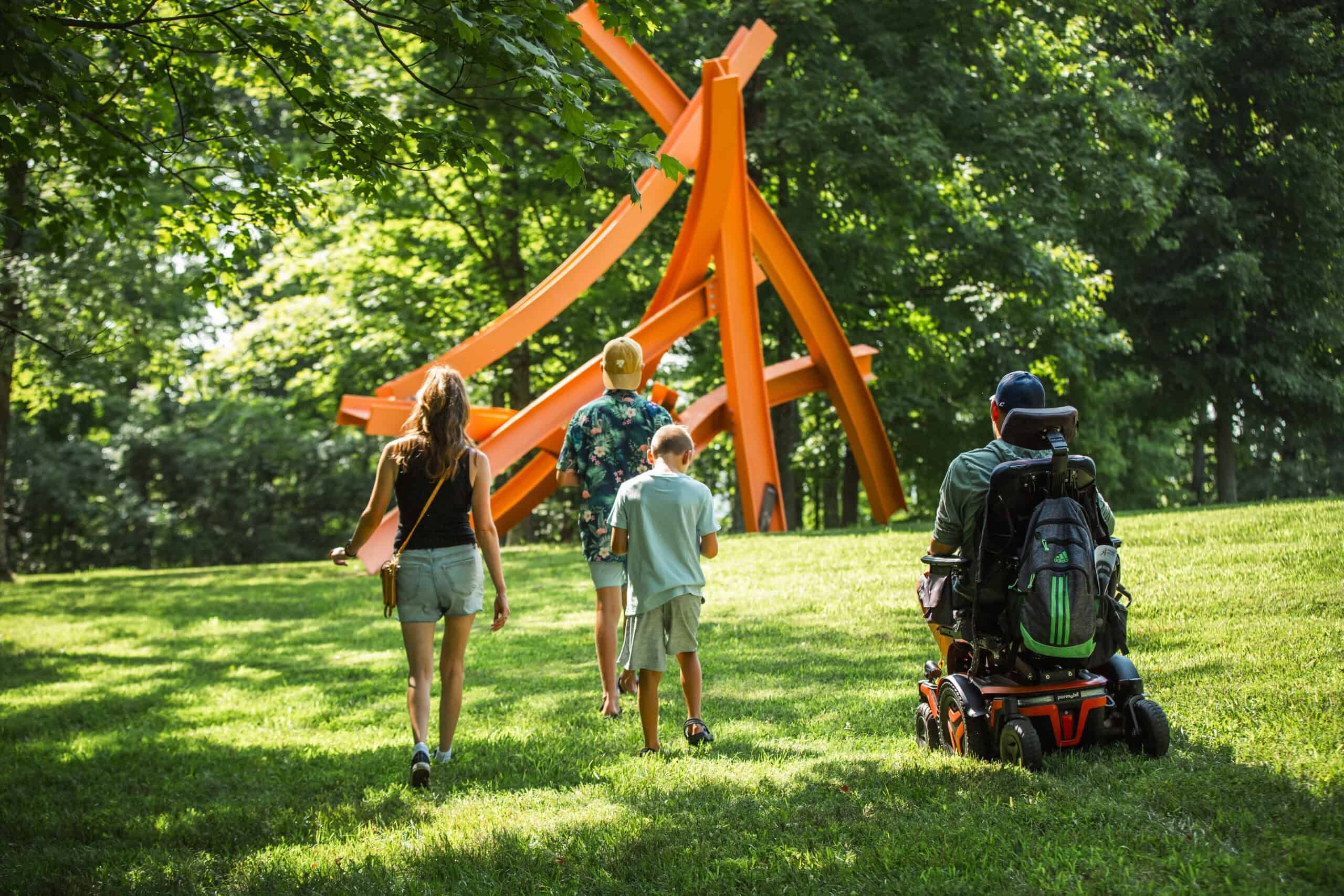 Family walking through an Art park