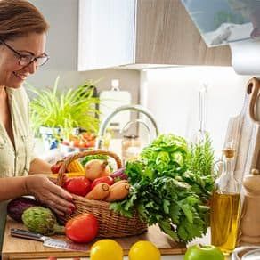 Women organizing vegetables